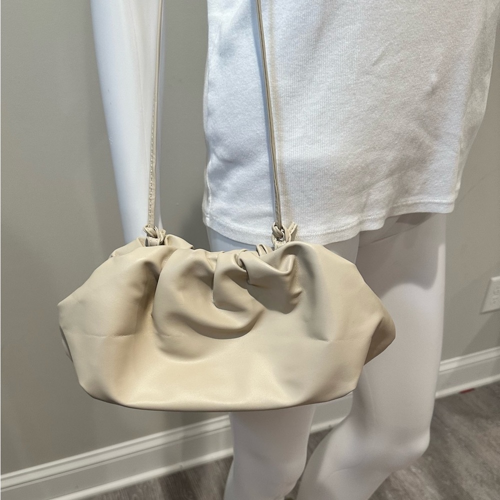 “Dumpling” purse. Straps pull to shorten.